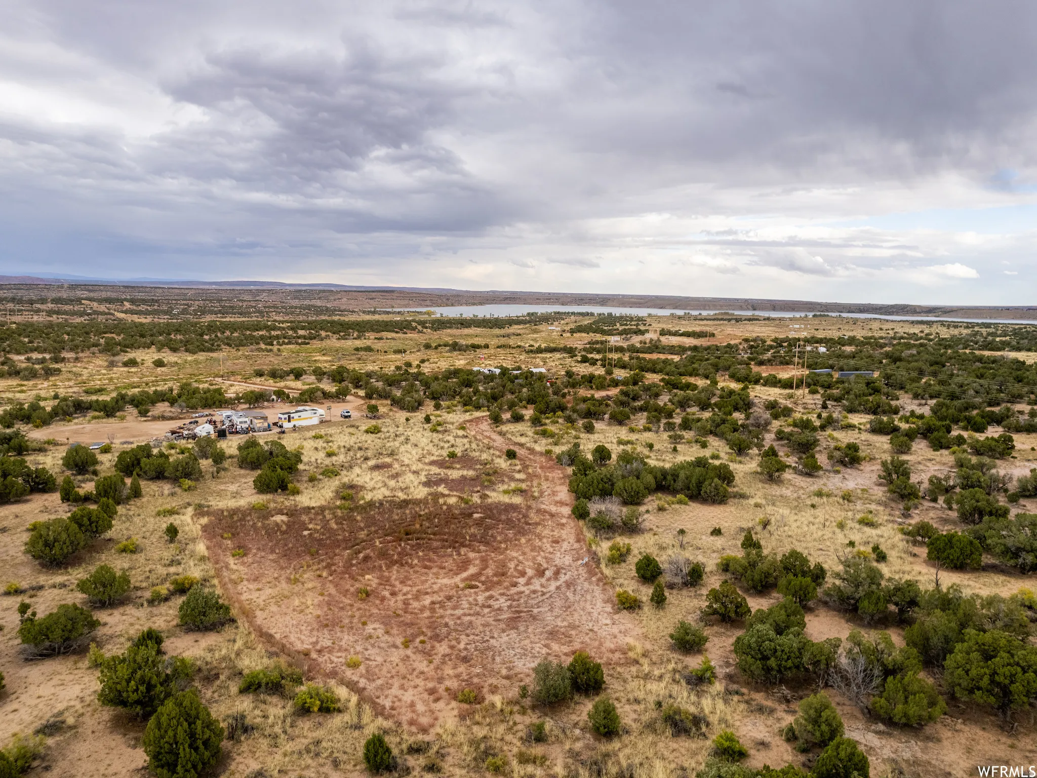 Expansive rural acreage with varied topography and scattered vegetation