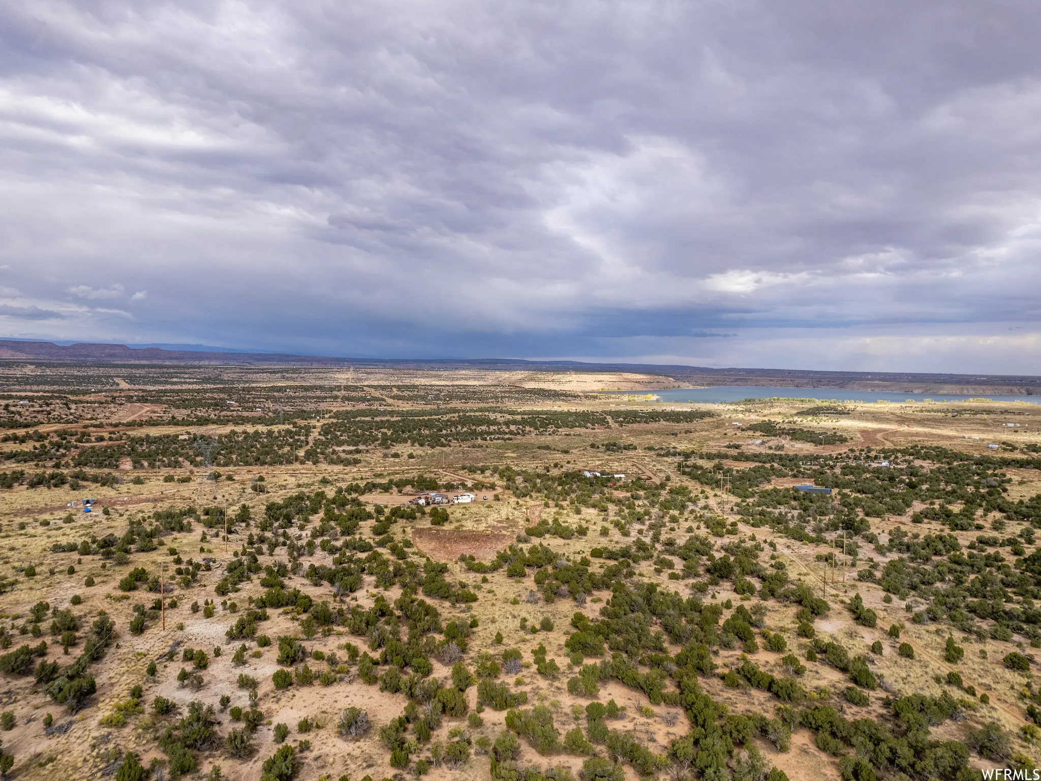 Expansive desert landscape with scattered green vegetation