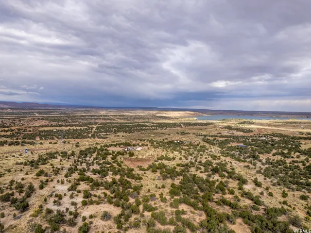 Expansive desert landscape with scattered green vegetation