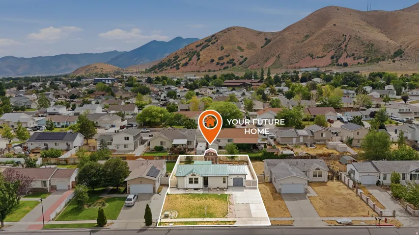 Aerial overview showcasing a residential neighborhood with mountain backdrops
