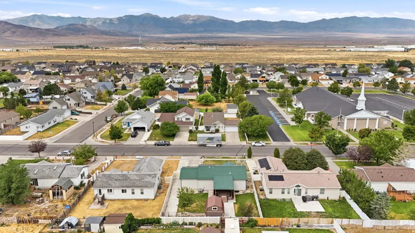 Residential neighborhood featuring a variety of single-story and two-story homes with pitched roofs