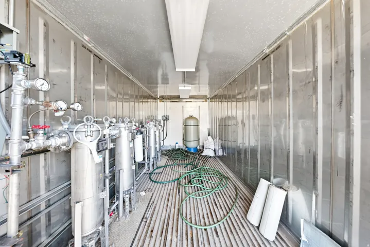 Industrial-grade equipment installation within a metal-lined structure,