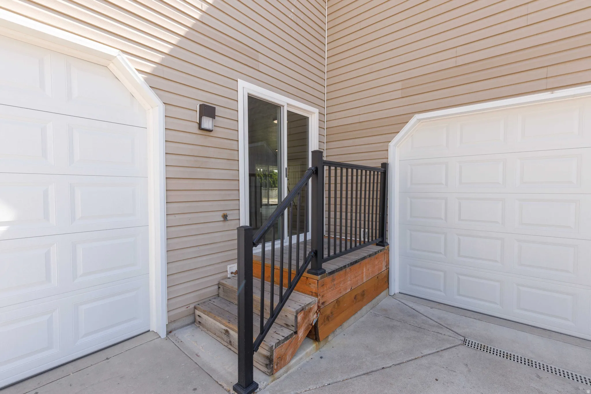 Exterior featuring light-toned horizontal siding
