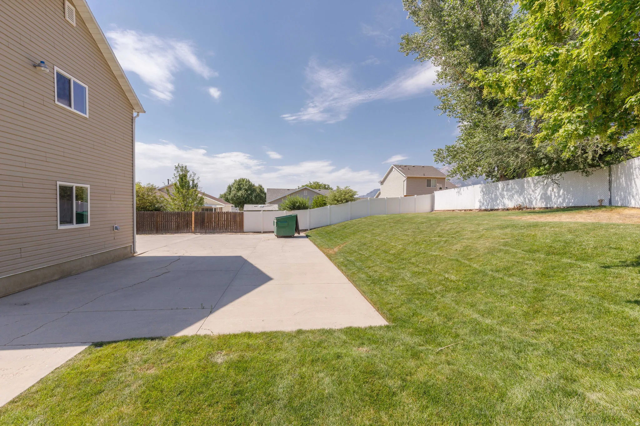 Expansive concrete patio and driveway area