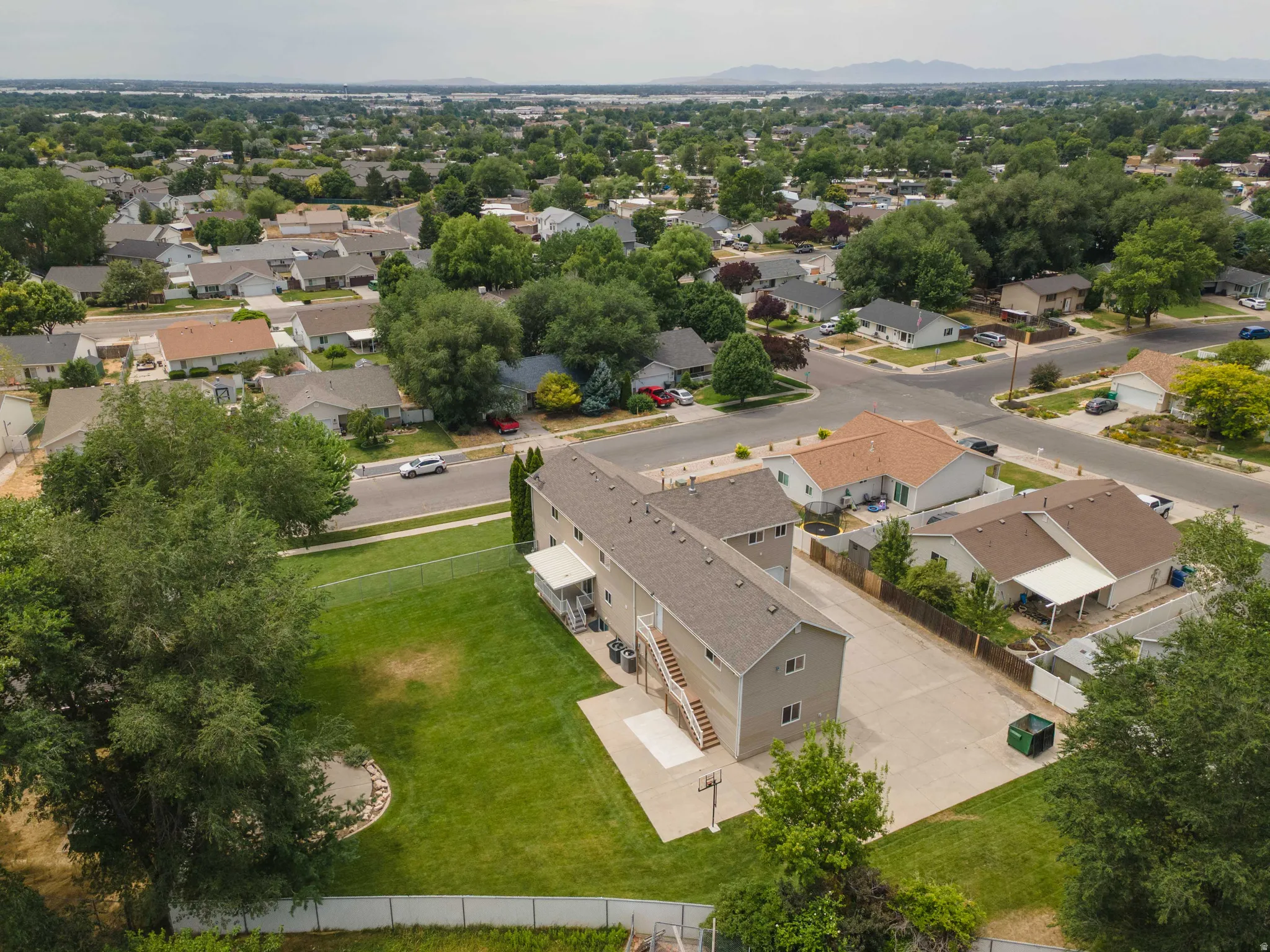 Multi-unit property with a gray facade and light gray roof