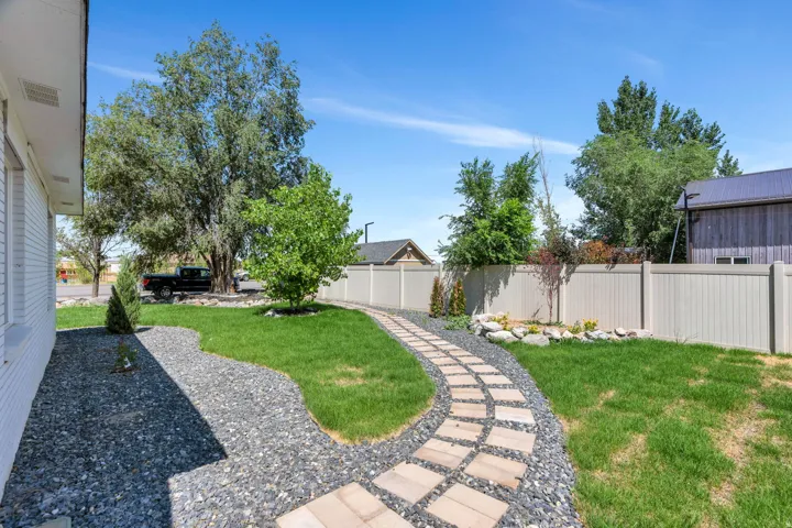 Curved stone pathway set within a xeriscape landscaping design