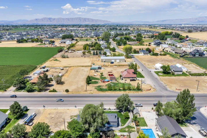 Aerial perspective showcasing a residential area with extensive land plots