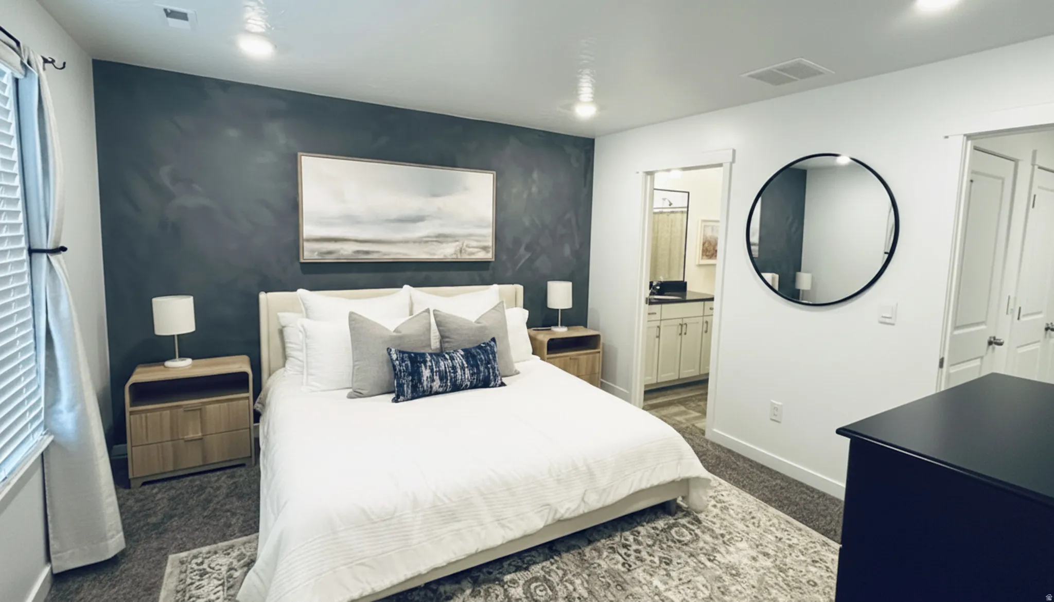 Spacious room featuring a textured accent wall, recessed lighting, and a window with blinds