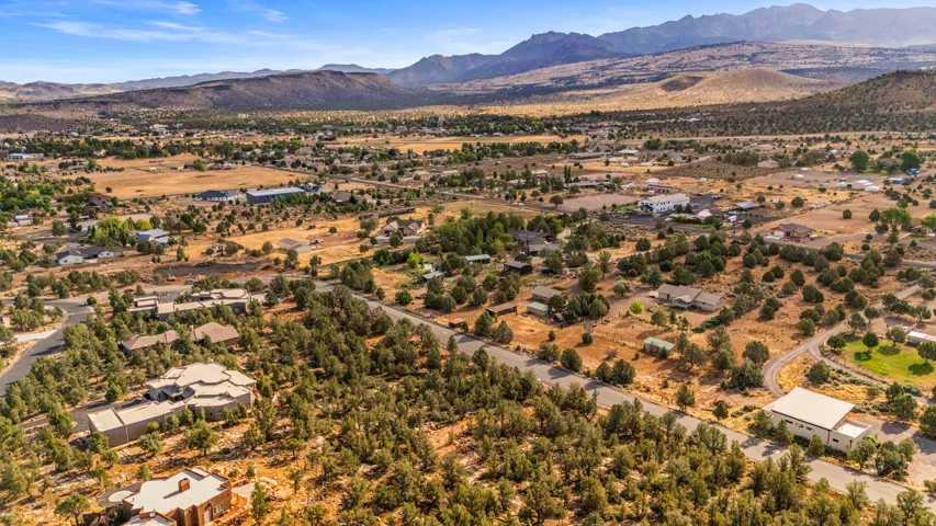 Expansive aerial perspective showcasing a residential community nestled within a natural landscape