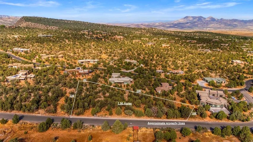 Expansive 1.50-acre lot featuring natural desert landscaping and direct road frontage