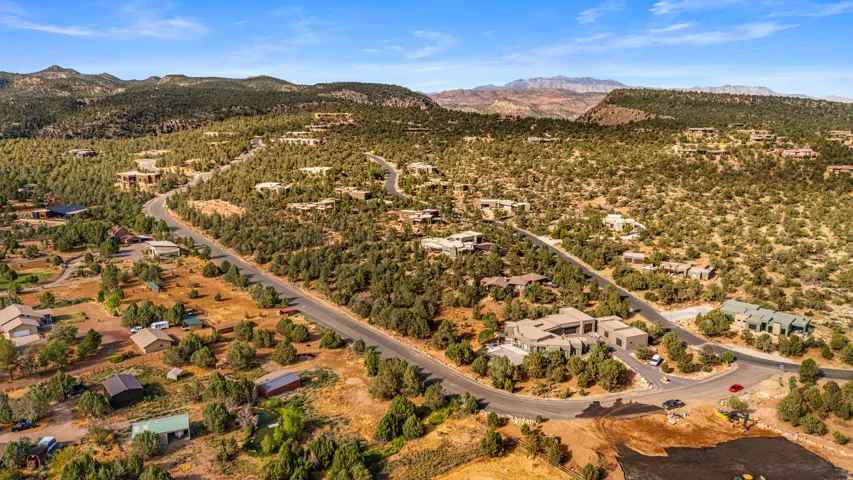 Expansive land parcels featuring established residential properties and natural landscaping