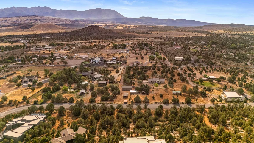 Expansive parcel featuring a natural landscape with mature trees and mountain scenery