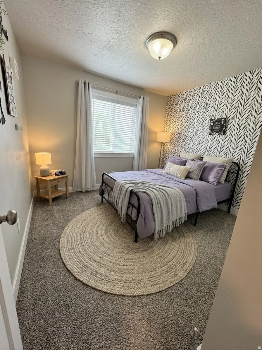 Plush carpeting, a bright window with blinds, and a distinctive accent wall with a leaf pattern.  AI enhanced design concept.