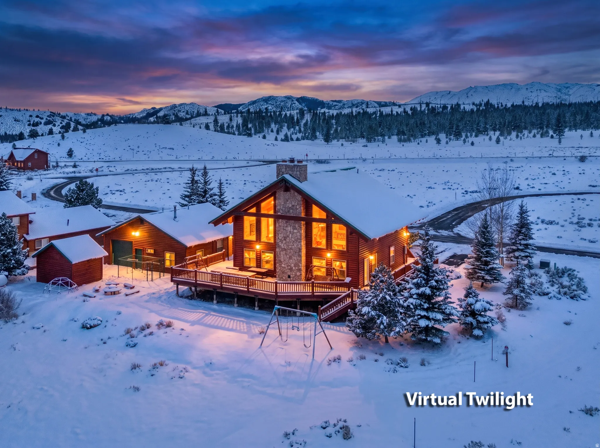 Expansive log cabin-style residence featuring a stone chimney and large windows