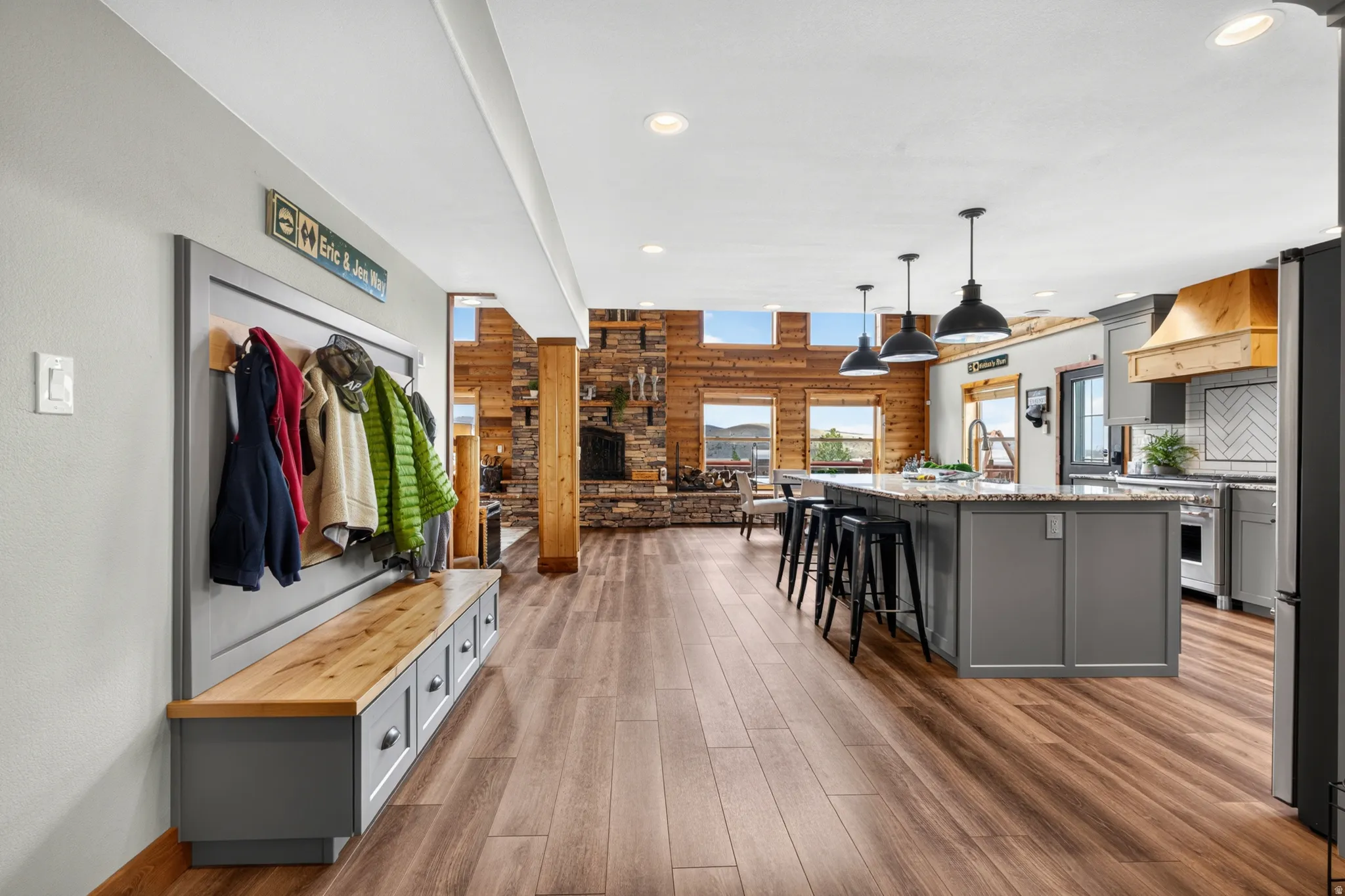 Open-concept living space with wood-finish flooring