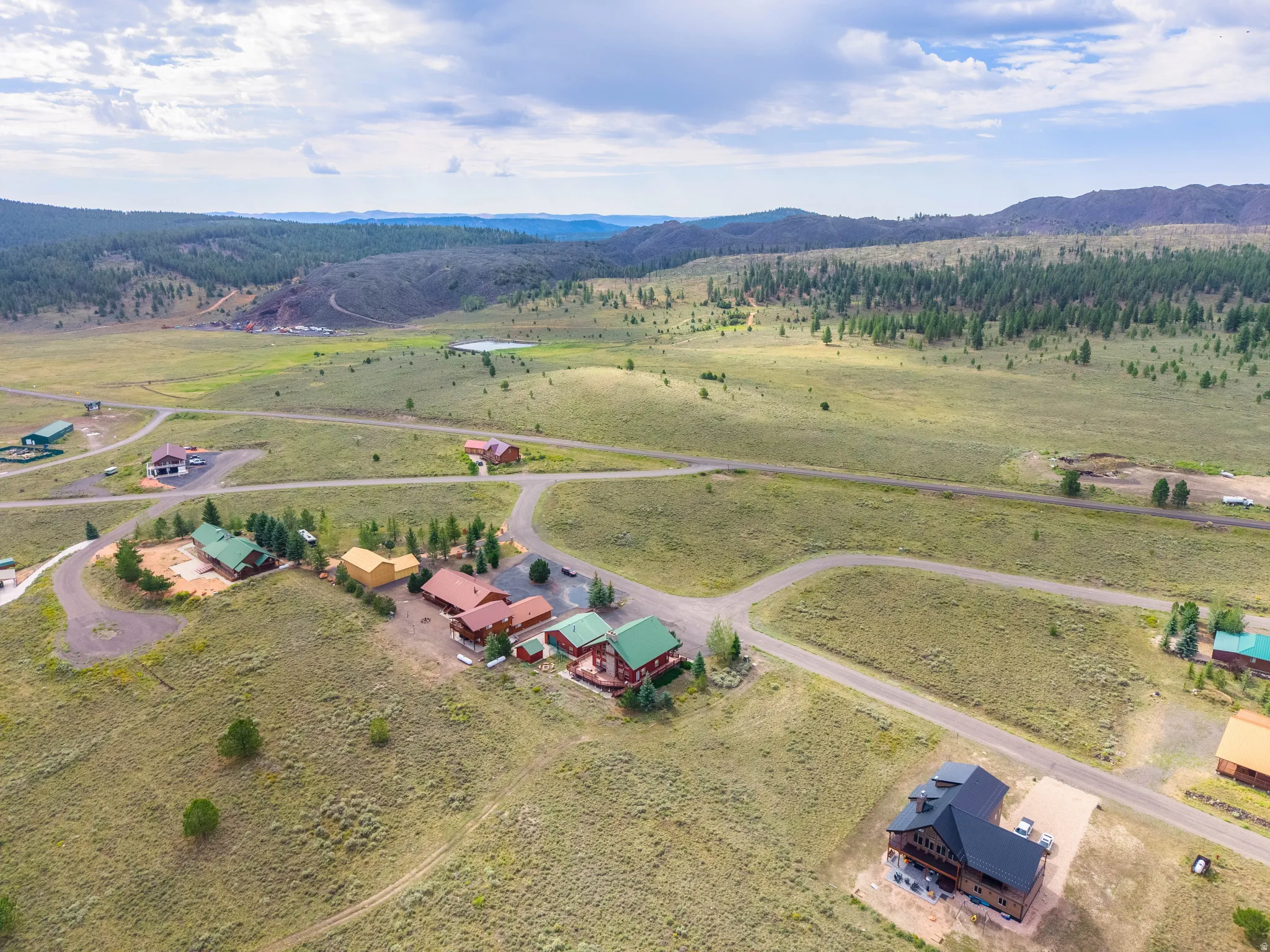 Expansive rural landscape featuring multiple homesites and winding roads