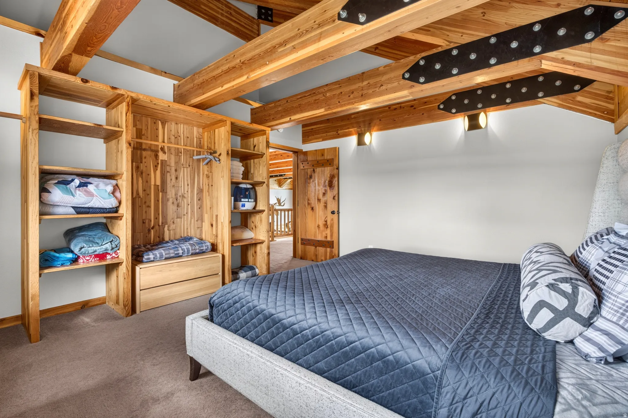 Vaulted wood-beamed ceilings with exposed structural elements
