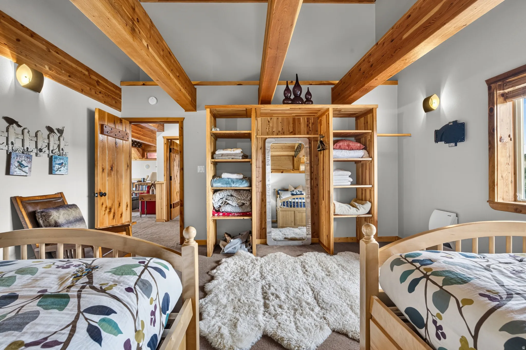 Vaulted ceiling featuring exposed wood beams