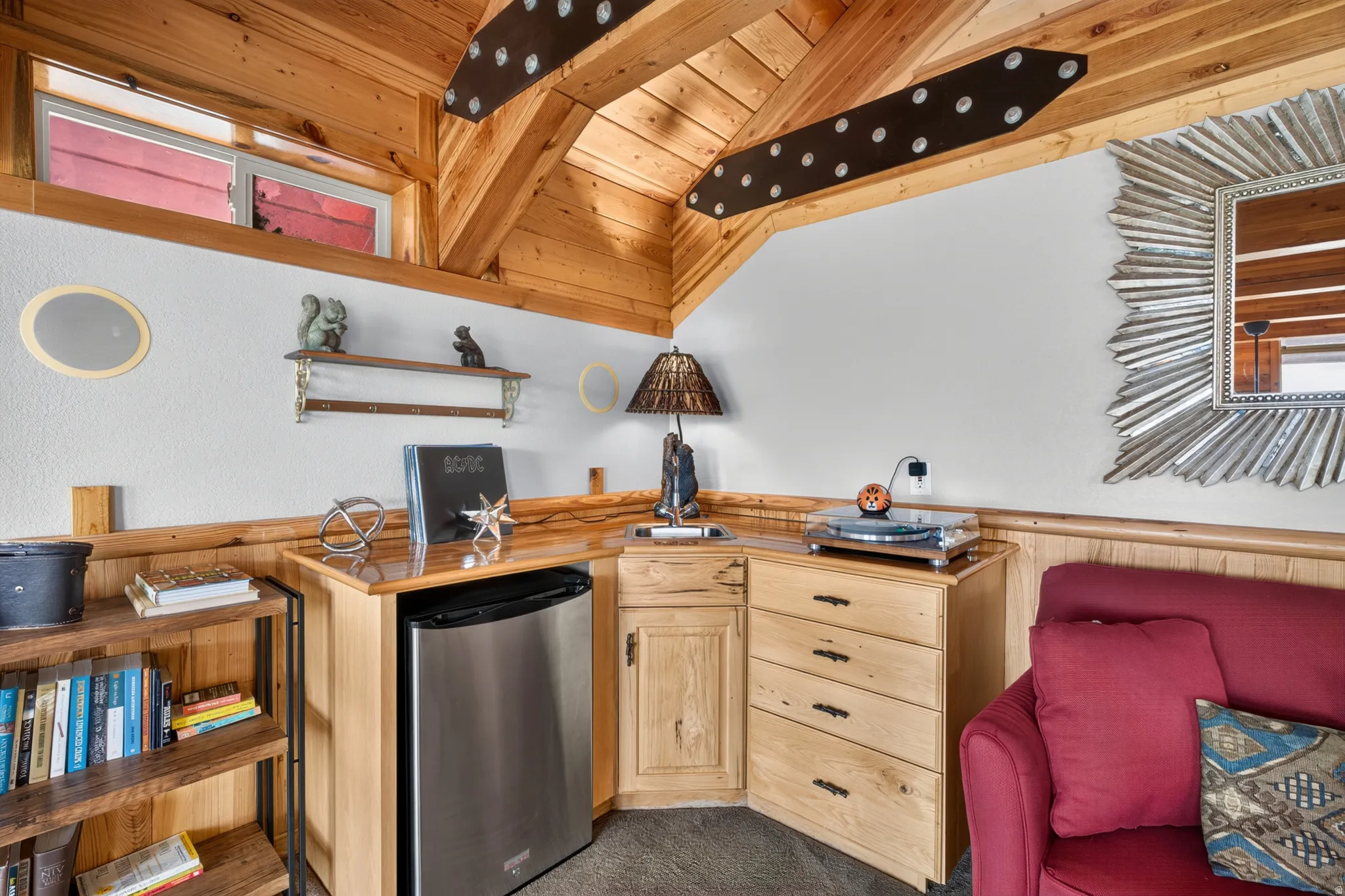 Vaulted wood-paneled ceiling with exposed beams