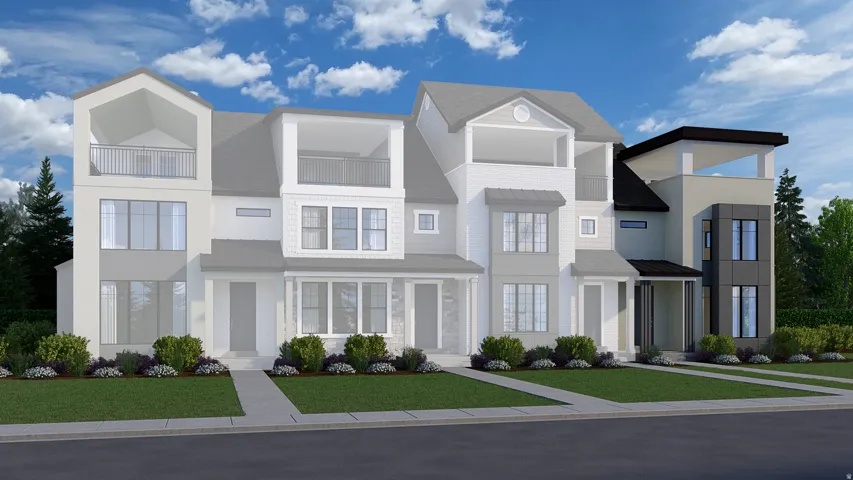 Modern townhome facade featuring a flat roofline and a recessed top-floor balcony
