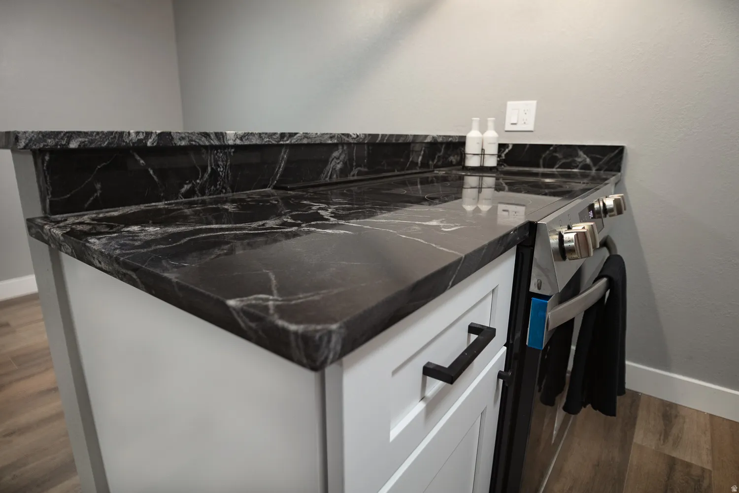 Dark marbled countertops with a matching backsplash