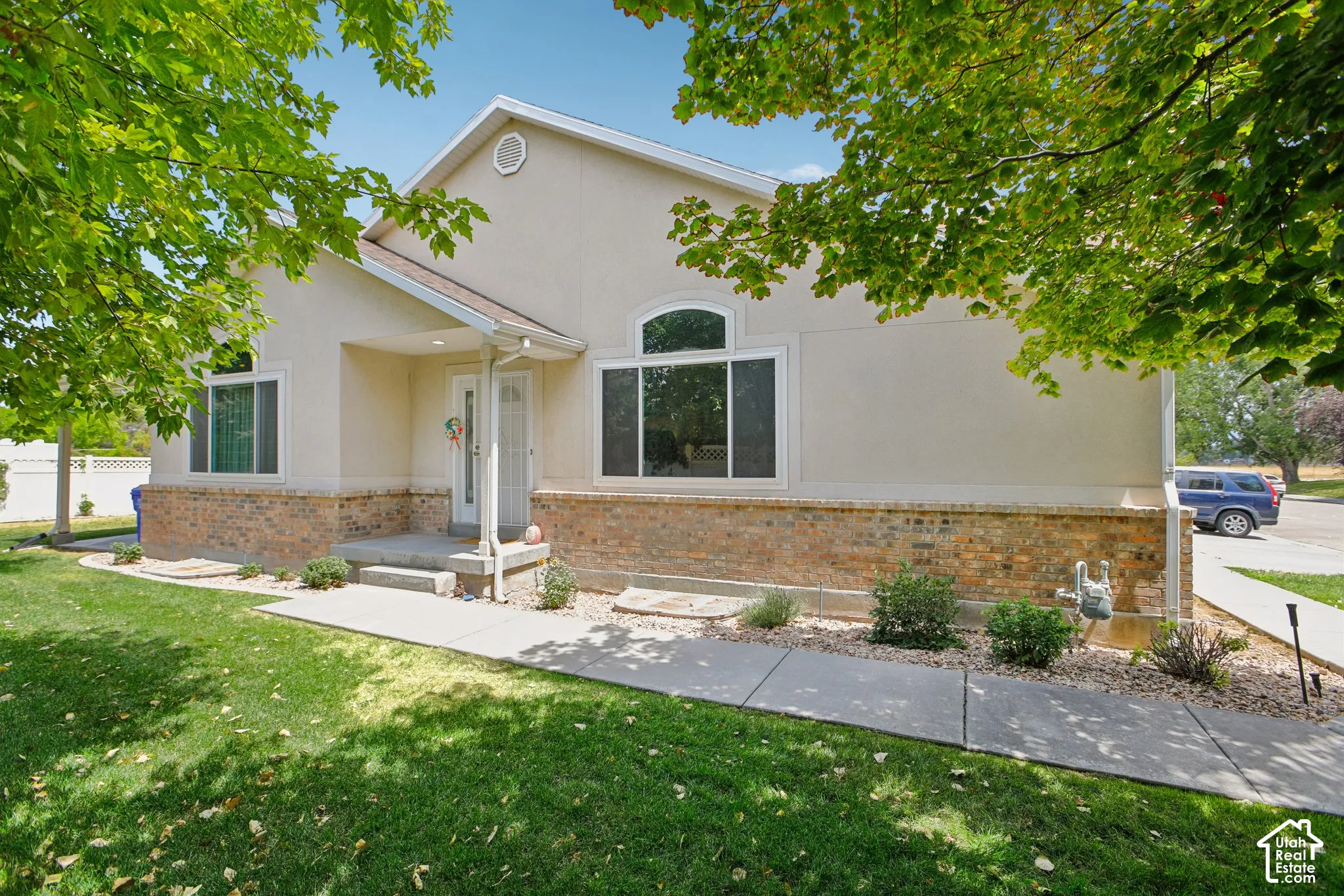 Contemporary exterior with a stucco and brick facade
