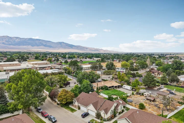 Expansive mountain backdrop with a wide residential and commercial landscape