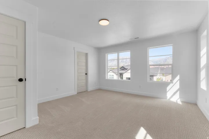 Neutral-toned carpeting throughout