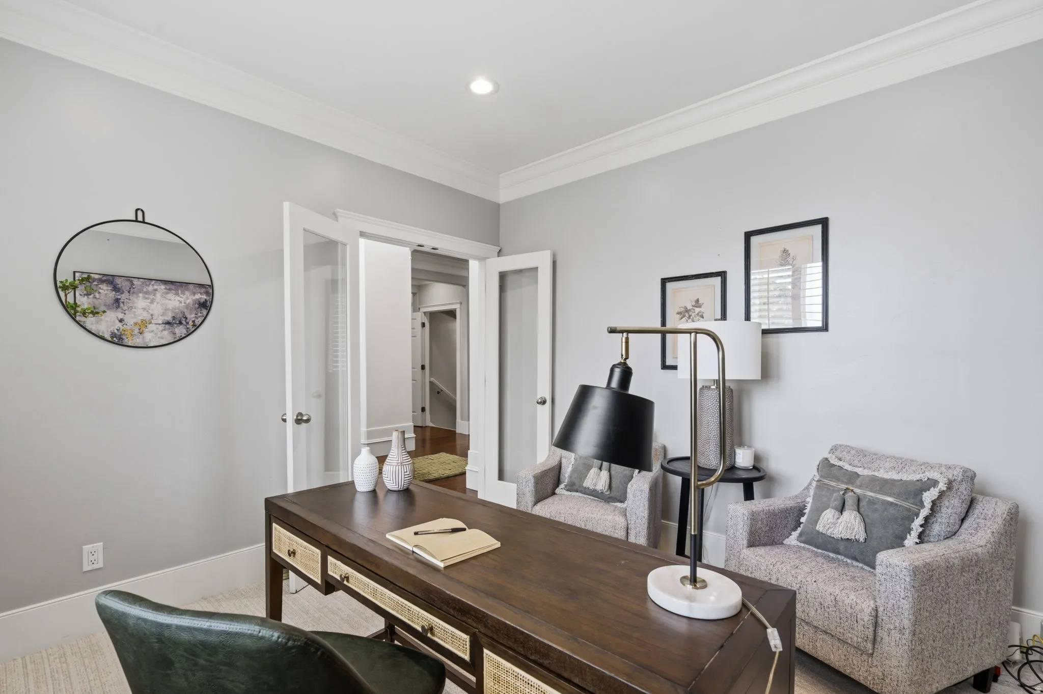 Private home office just off the entry with glass double doors, 9-foot ceilings, recessed lighting and abundant natural light.