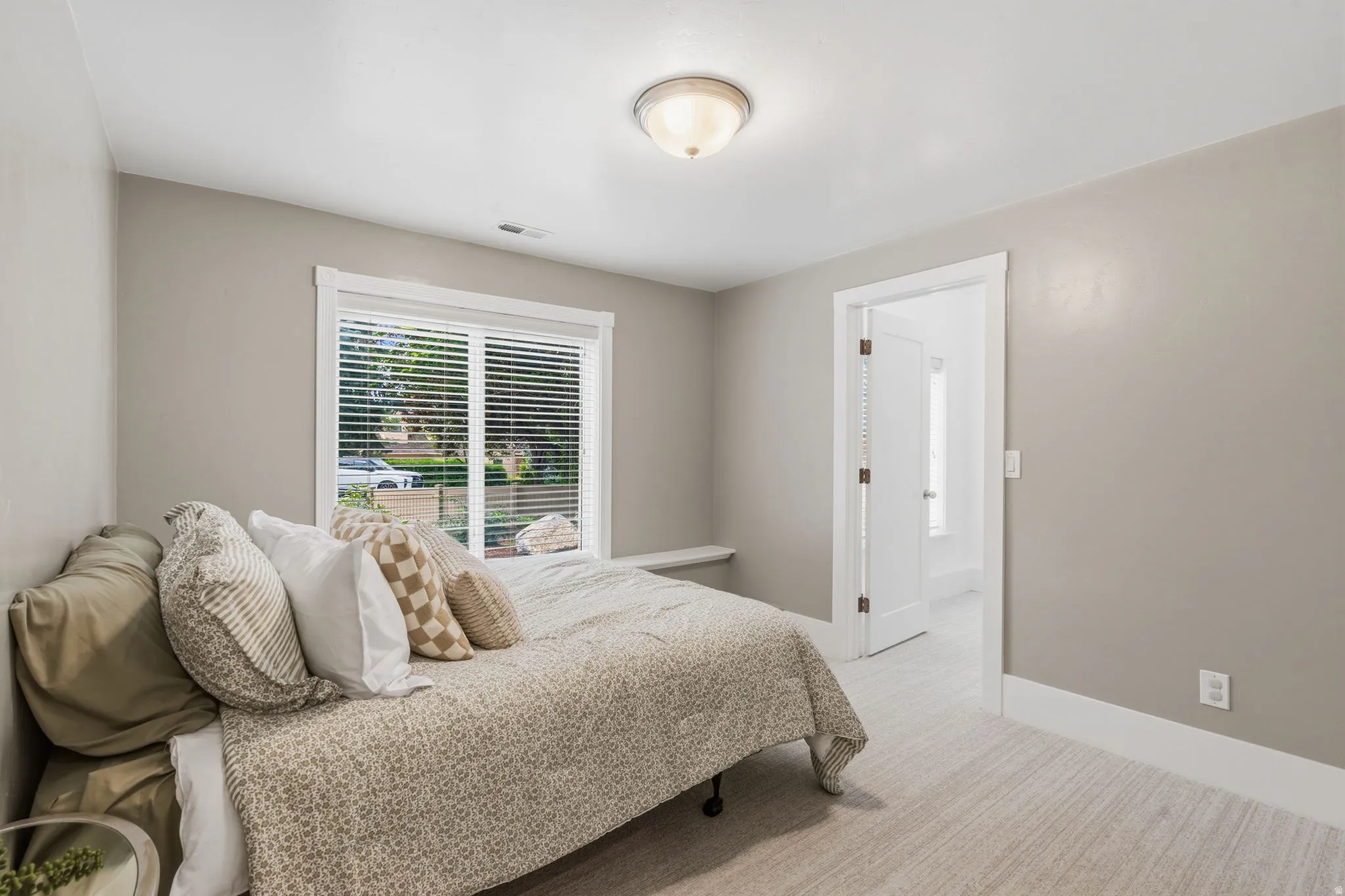 Bedroom #6--Spacious bedroom with 9-foot ceilings and a large above-grade window overlooking the front yard.  Large walk-in closet with the rare bonus of its own full-size window, providing wonderful natural light.