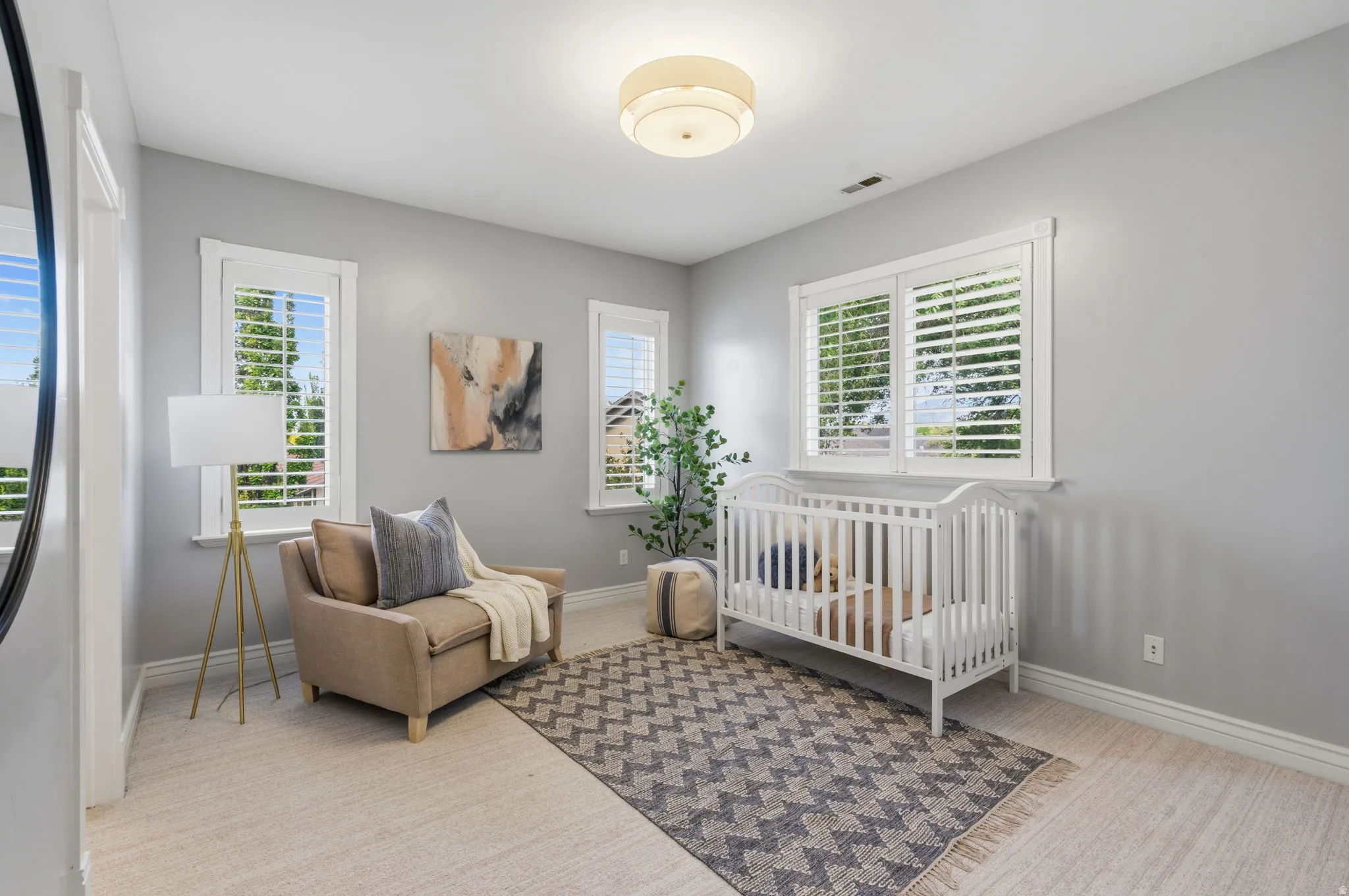 Bedroom #4--Bright, inviting bedroom with 9-foot ceilings and 3 large windows providing beautiful natural light.