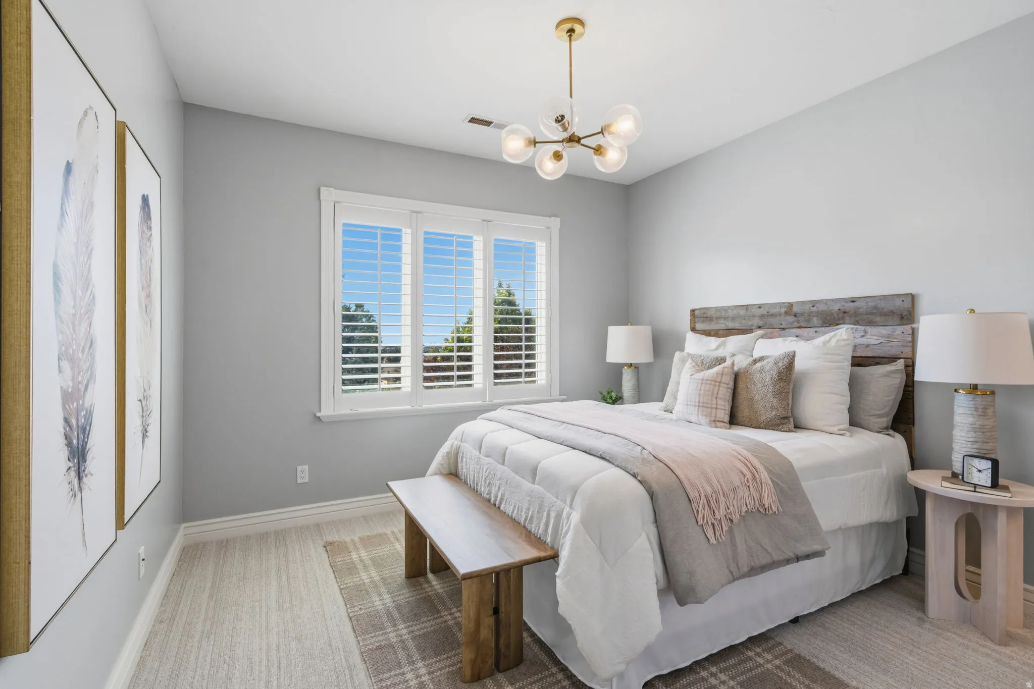 Bedroom #3 --Spacious light filled  bedroom with 9-foot ceilings, a beautiful chandelier, and a large window.  Bedrooms 3 & 4 each enjoy their own private vanity area while sharing the enclosed  tub/shower and toilet room.