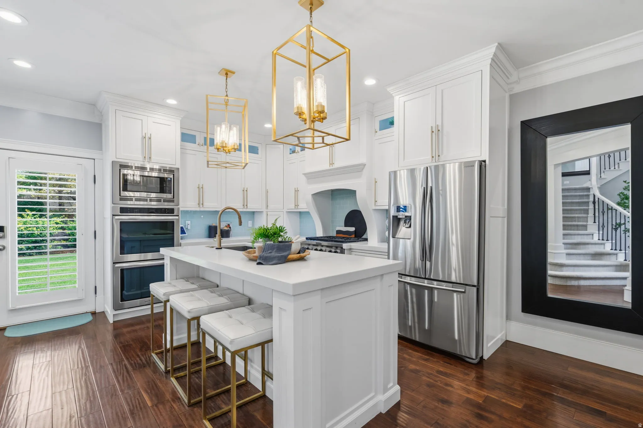 5-Burner cooktop, double ovens, generous pantry, plus built-in credenza--perfect for extra storage and entertaining.