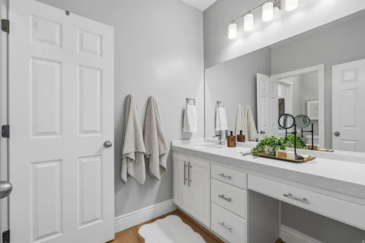 Bedroom #4 Jack n Jill Private vanity features a sink and generous drawer and cabinet storage, plus dedicated makeup area. Bedrooms 3 & 4 each enjoy their own private vanity area while sharing the enclosed  tub/shower and toilet room.