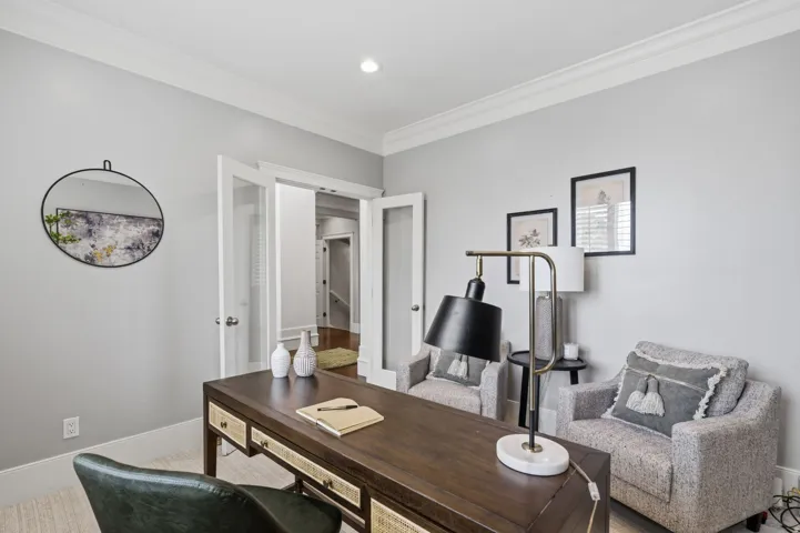 Private home office just off the entry with glass double doors, 9-foot ceilings, recessed lighting and abundant natural light.