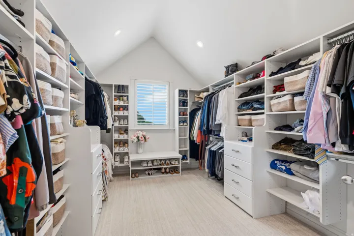 Primary bath flows directly into a large walk-in closet with includes a hidden storage area--perfect for luggage, gifts, seasonal items, and everything you want to keep out of sight.