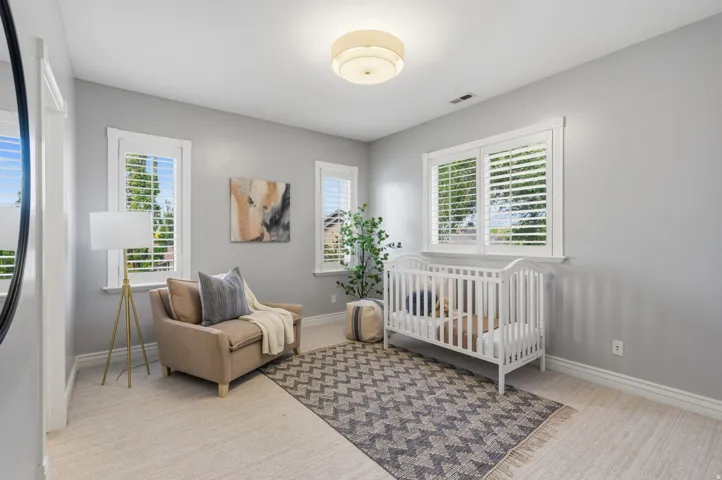 Bedroom #4--Bright, inviting bedroom with 9-foot ceilings and 3 large windows providing beautiful natural light.