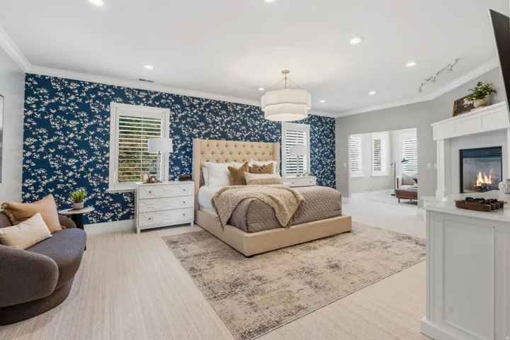 Primary Retreat is spacious enough for a sitting area and additional furniture while still feeling open, bright, and comfortable