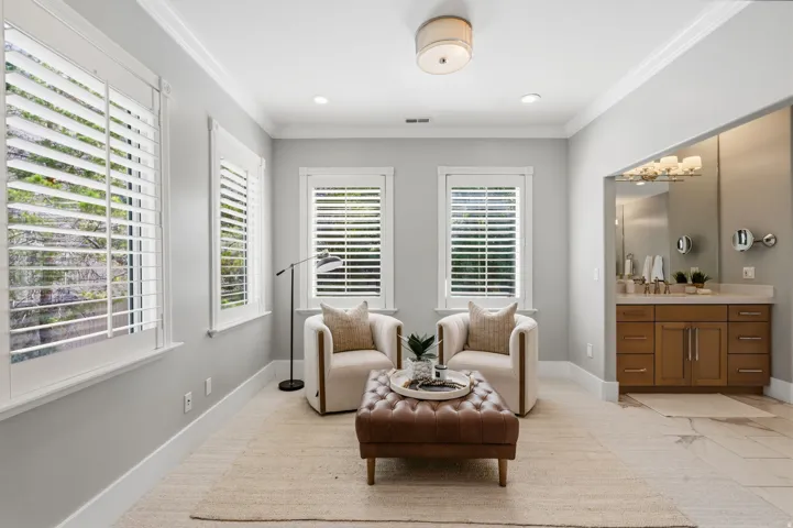 Primary retreat also includes a separate sitting area surrounded by four large windows which create a bright, peaceful space to relax.