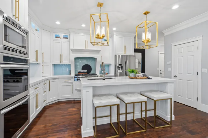 Spacious, well-designed kitchen w large island, seating for three, and abundant storage