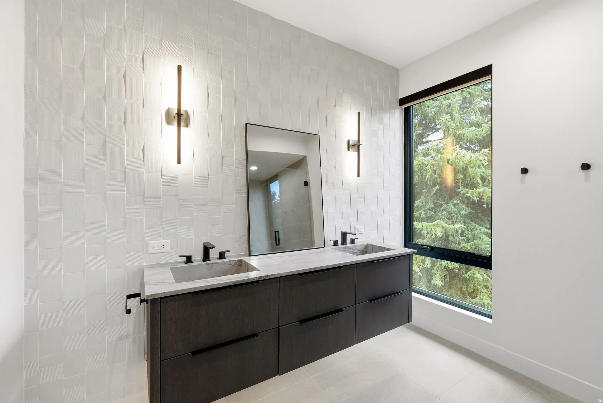 Floating dual vanity with integrated rectangular sinks, stone countertop, and matte black fixtures
