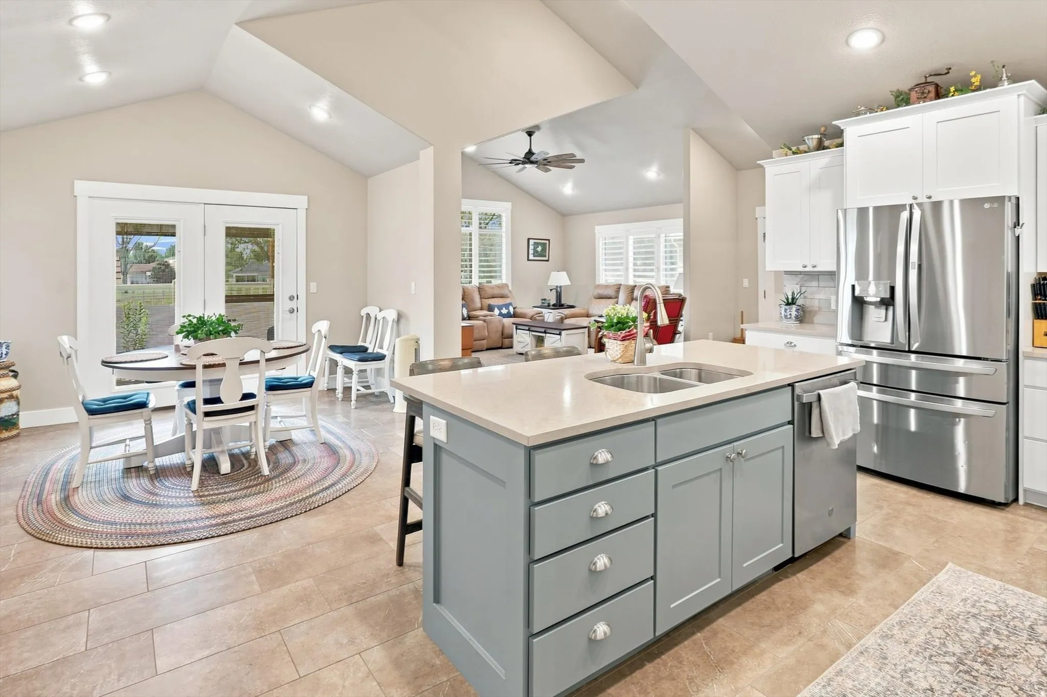 Open-concept kitchen and dining area with vaulted ceilings