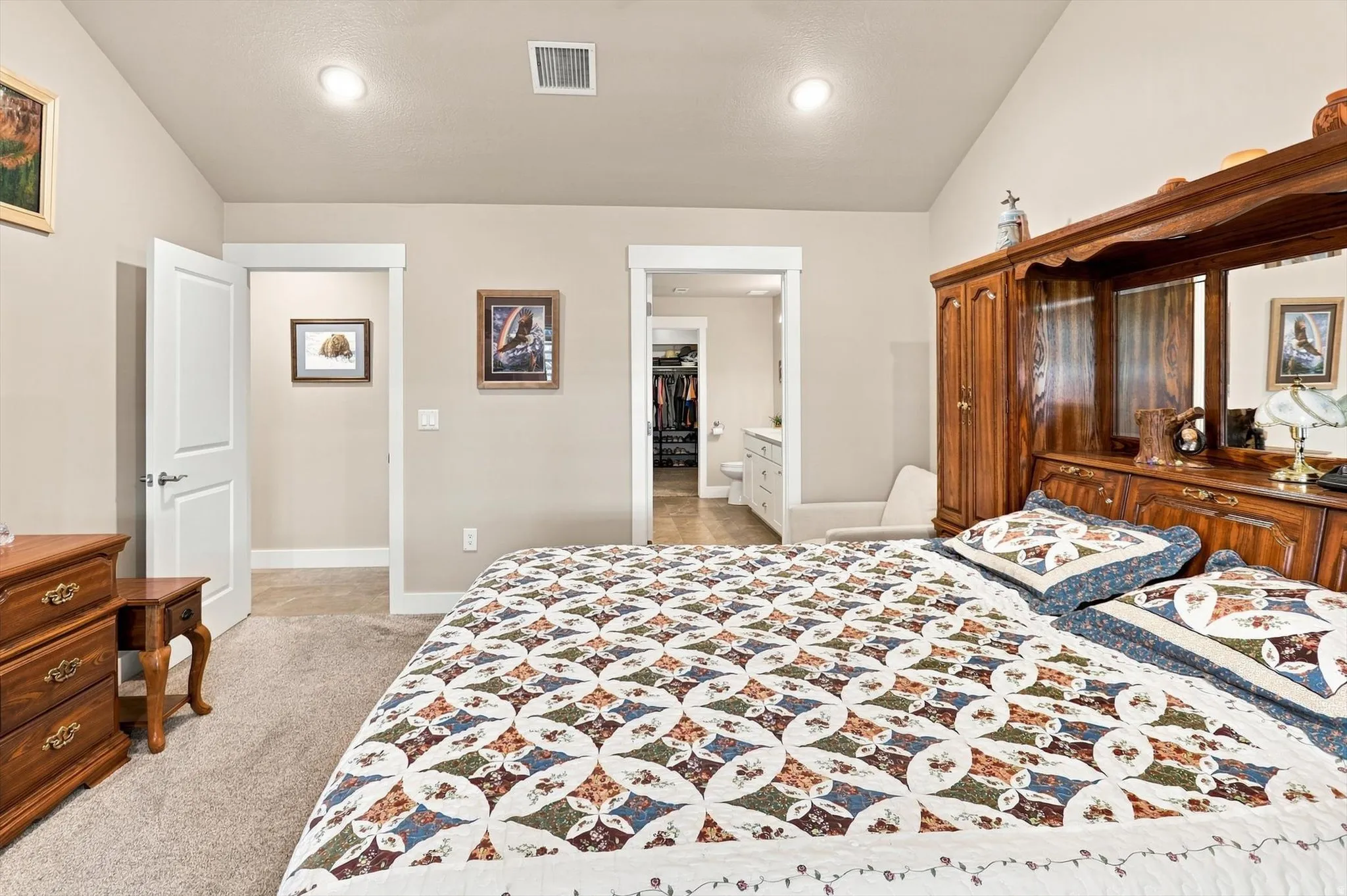 Bedroom featuring neutral-toned walls, recessed lighting, and carpeted flooring