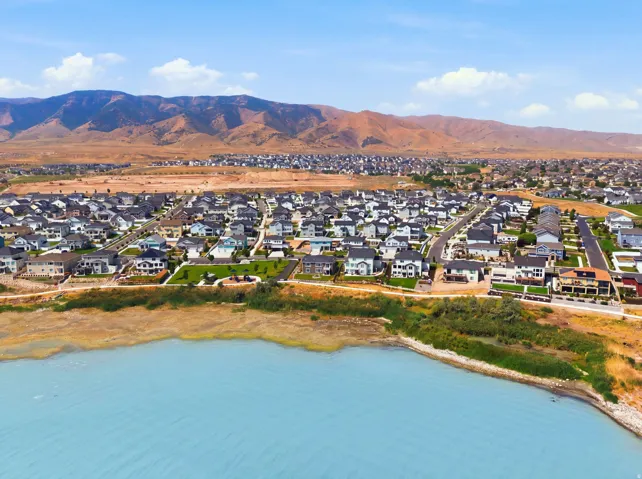 Expansive neighborhood featuring numerous residential properties and a prominent body of water