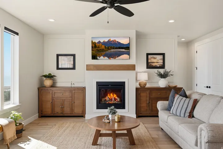 Recessed lighting, wood-finish flooring, a contemporary fireplace, and a ceiling fan