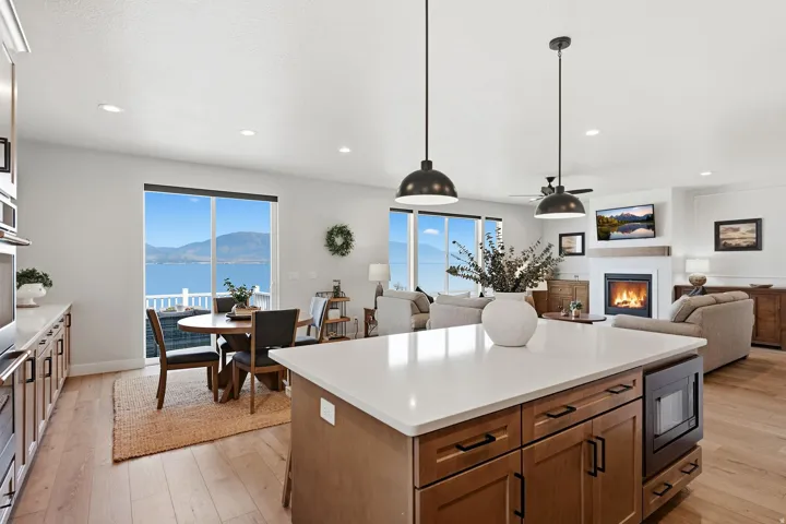 Spacious open-concept interior with wood-finish flooring