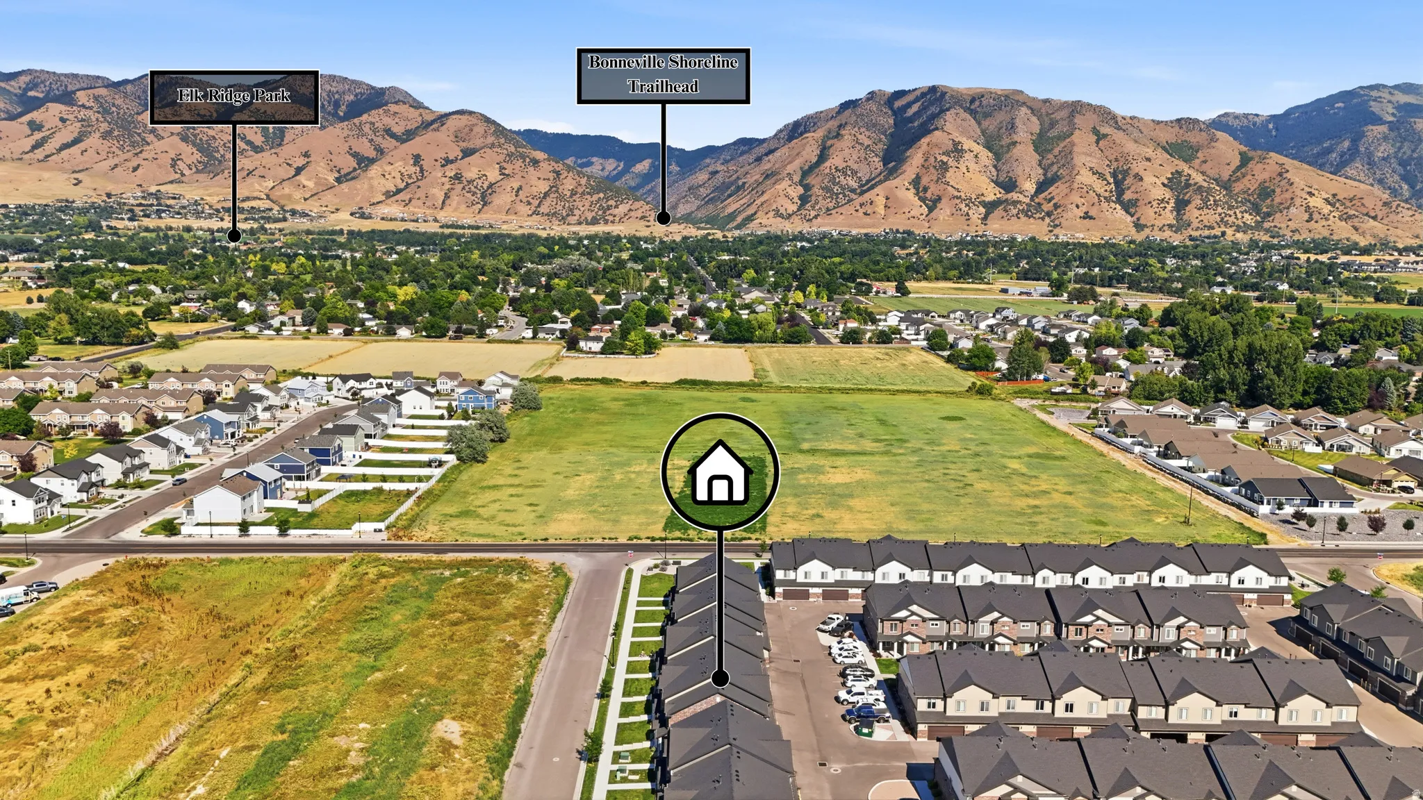 Aerial perspective showcasing a residential area with undeveloped land