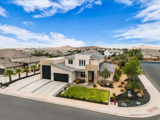 Contemporary exterior featuring a stucco facade and stone accents