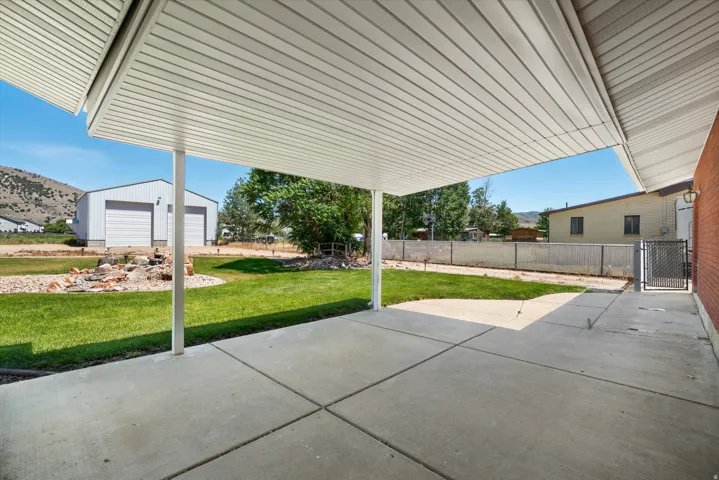 Expansive covered patio featuring concrete flooring