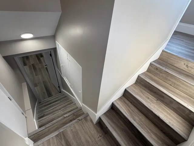 Wood-finish flooring throughout the staircase and hallway